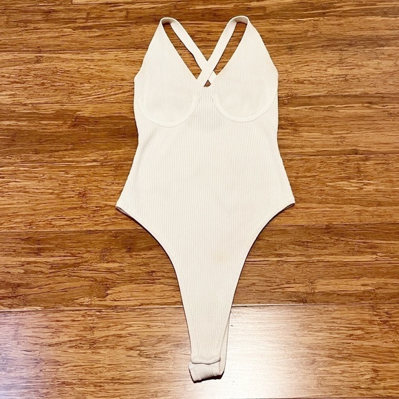 ASOS Tops - ASOS white ribbed french cut snap body suit w/ criss-cross back. Size 8